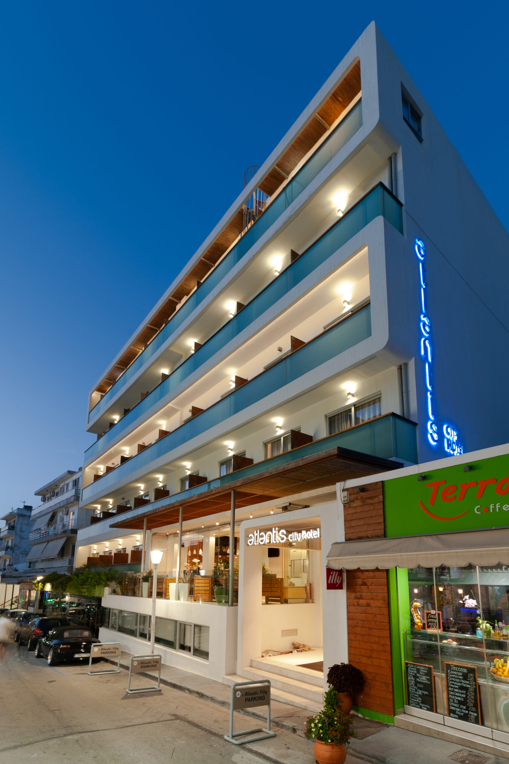 Exterior view of Atlantis City Hotel, showcasing its modern urban design and central location.